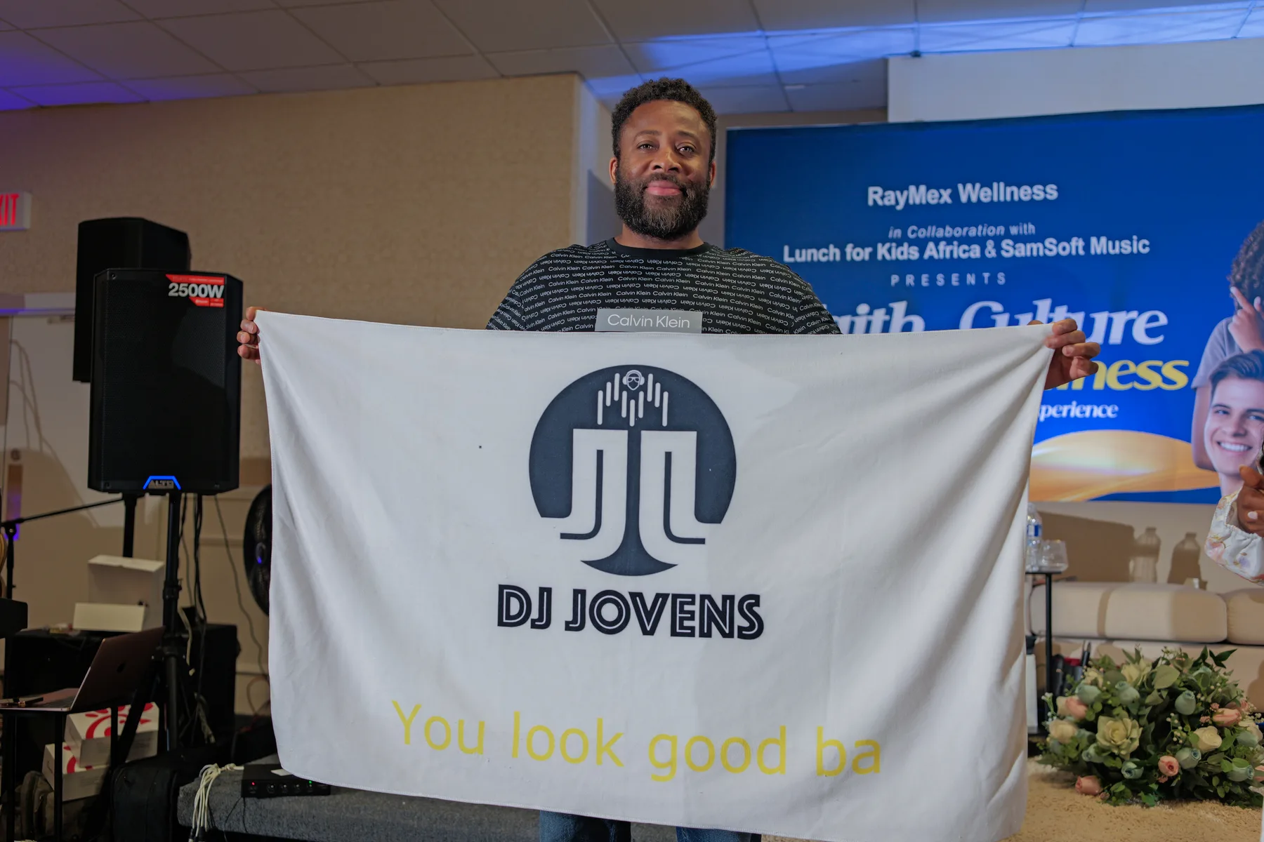 Event vendor and DJ station providing live music at the community wellness event